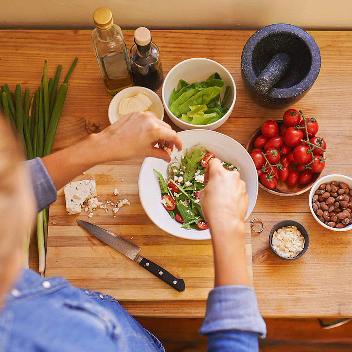 Person preparing a salad