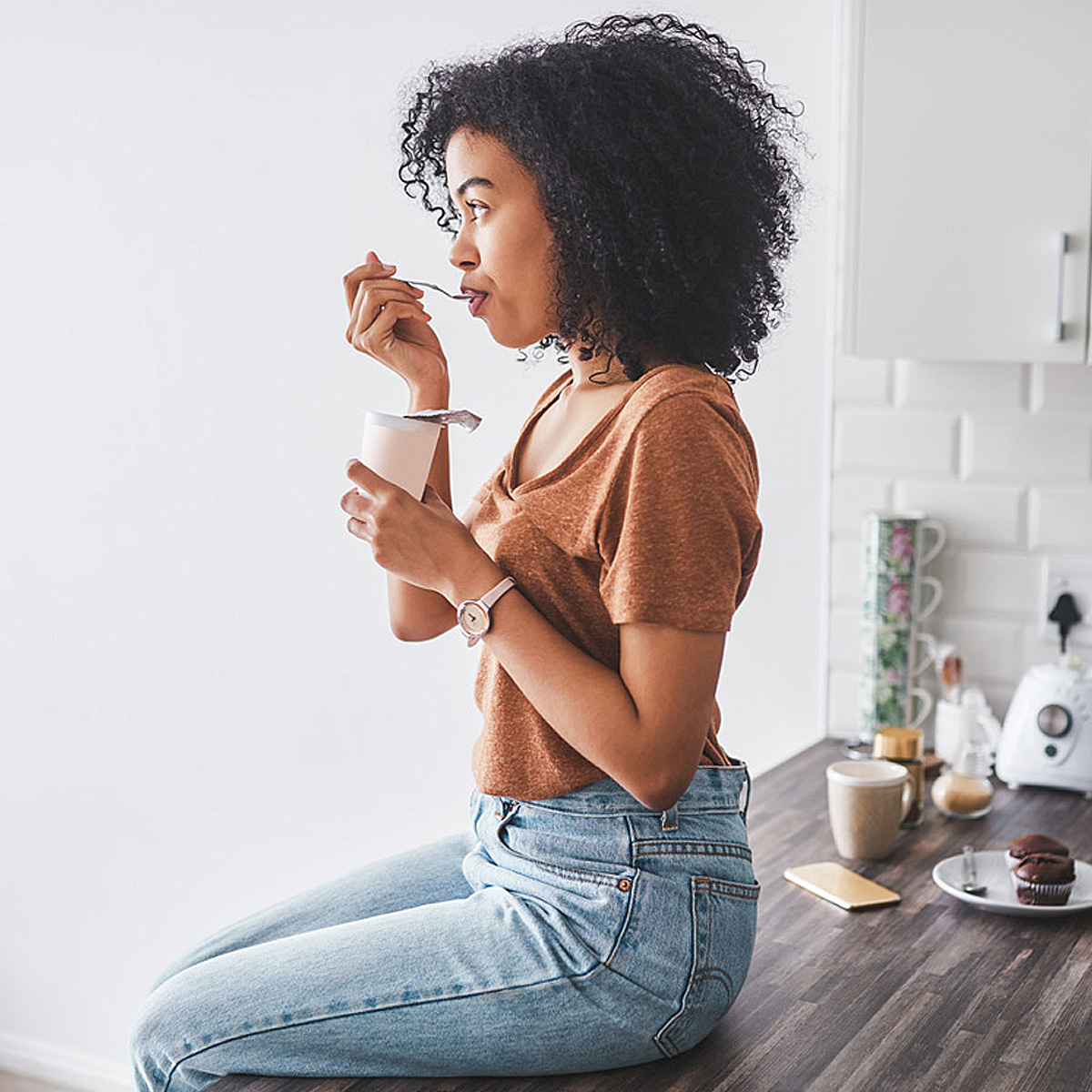 Woman eating yogurt