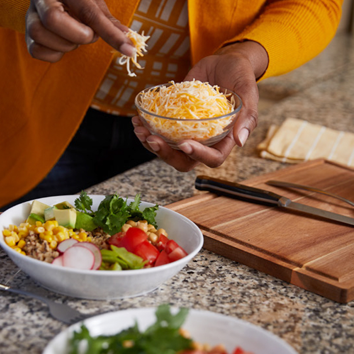 Person preparing a salad