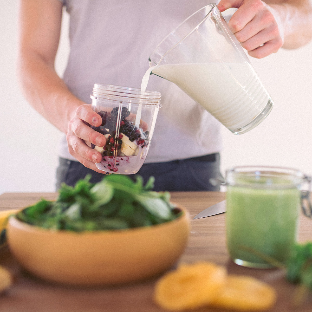Person preparing a smoothie
