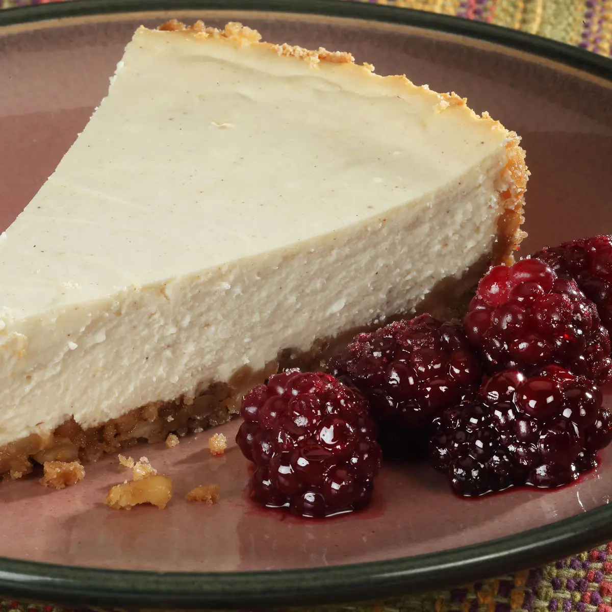 Greek Yogurt Cheesecake with Piñon Nut Crust and Roasted Blackberries